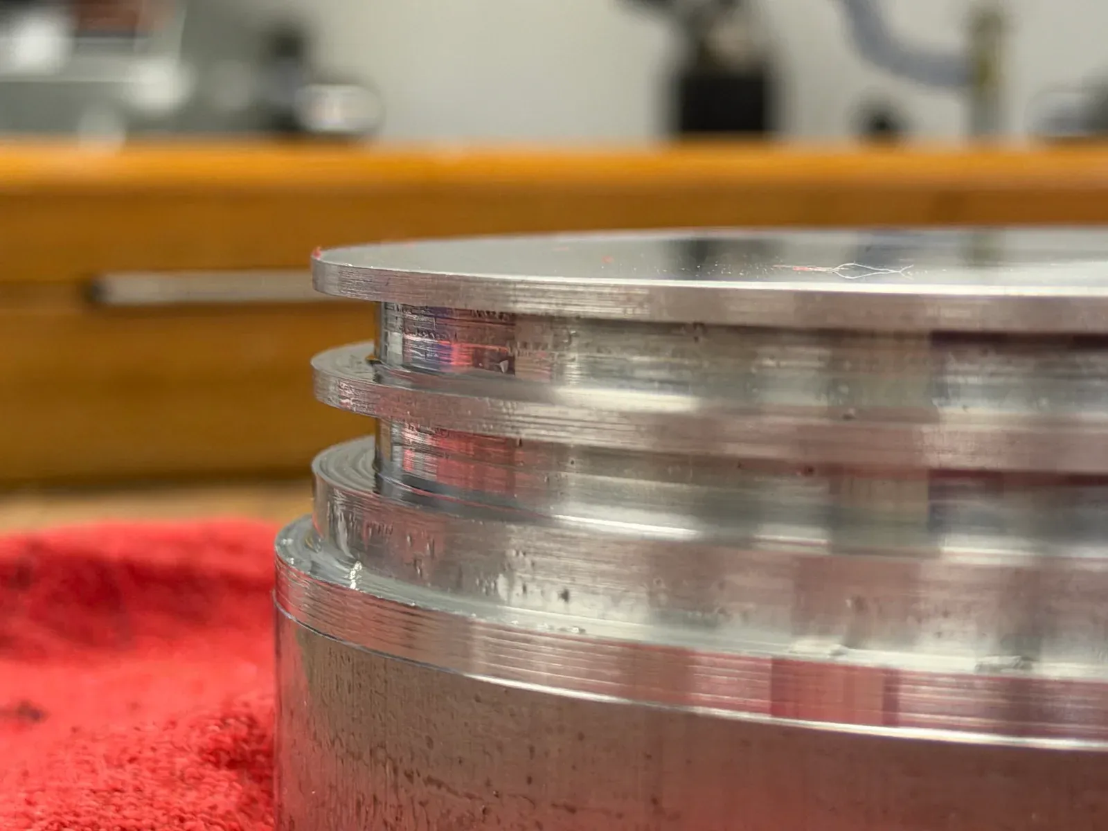 Close-up of grooves and tool marks on a machined metal component.